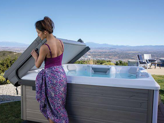 a hot tub cover lifter can act as a hot tub privacy screen