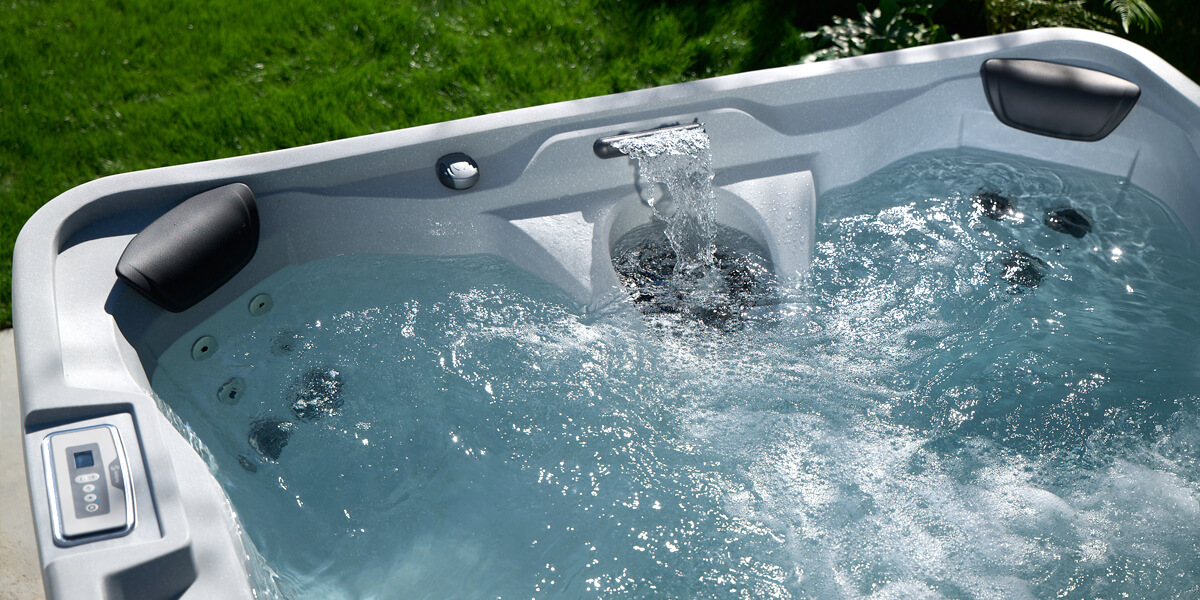 Gently rolling jets and waterfall create serene ambiance