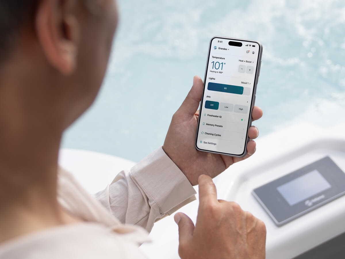 Man using the Hot Spring Spas app from his Smart phone.